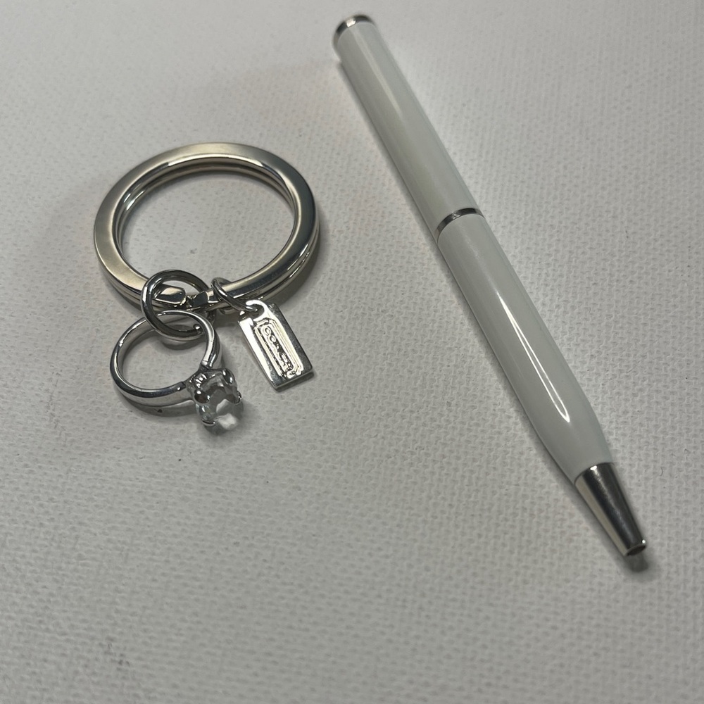 Coach Mini Silver Ring Keychain with a White Coach Pen